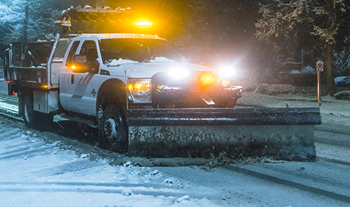 Commercial snow plowing and removal in Rockland County snow plow working at night on Commercial business in Rockland County